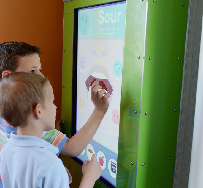 Children Interacting With Touch Screen Museum Exhibit